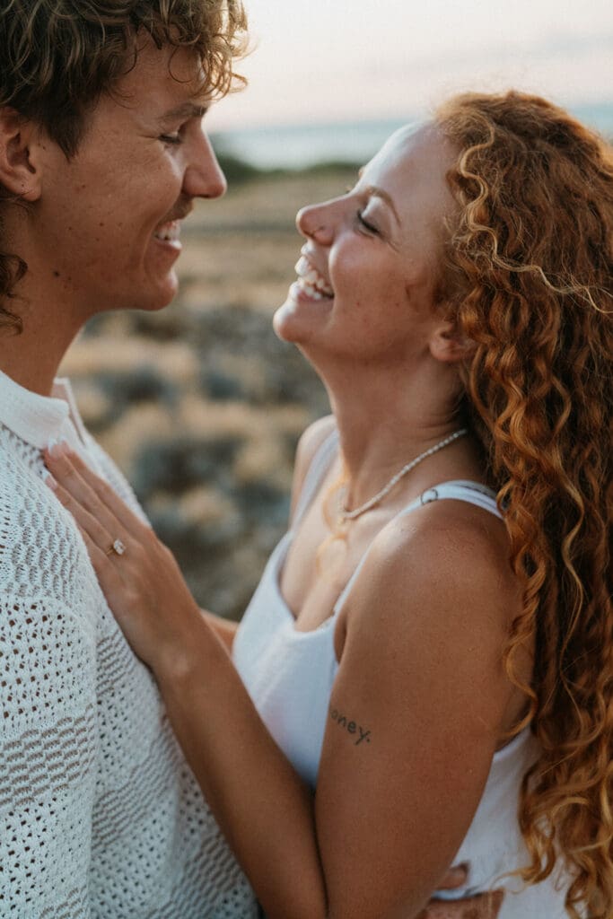 Couple Laughing On The Big Island At Sunset