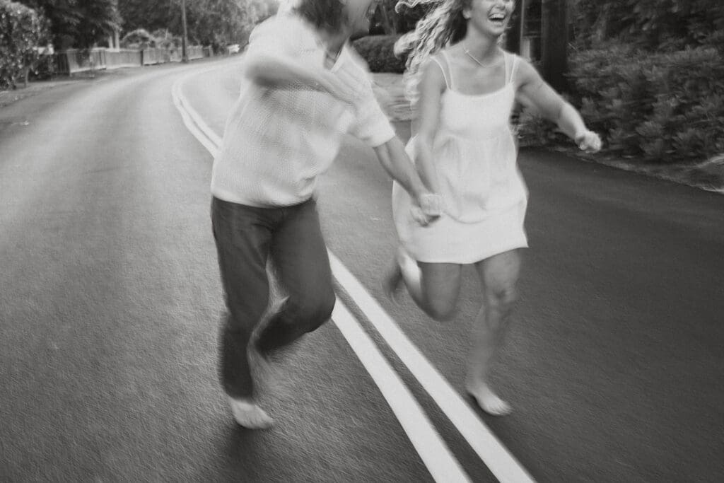 Couple Walking On A Road On The Big Island At Sunset
