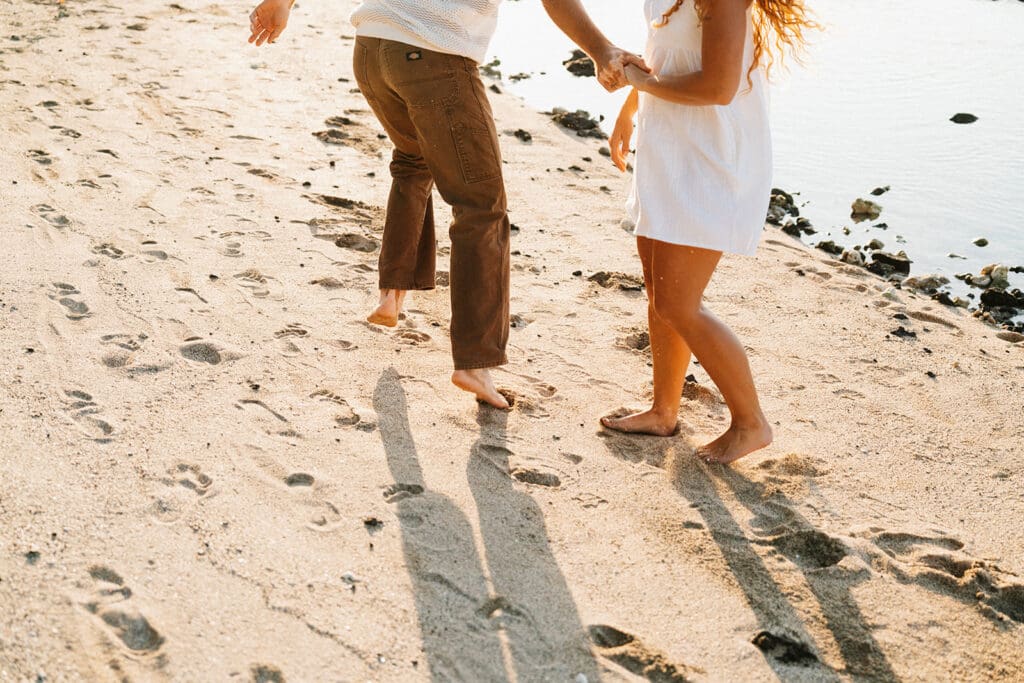 Couple Running On The Beach On The Big Island At Sunset