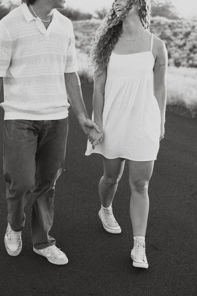 Couple Walking On A Road On The Big Island At Sunset