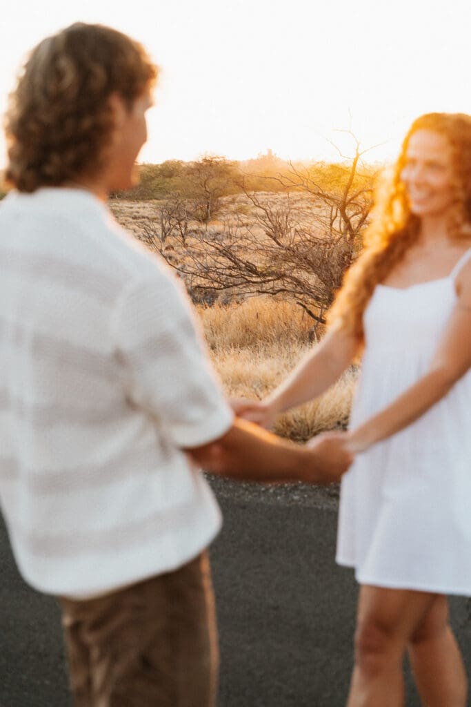 Couple Laughing On The Big Island At Sunset