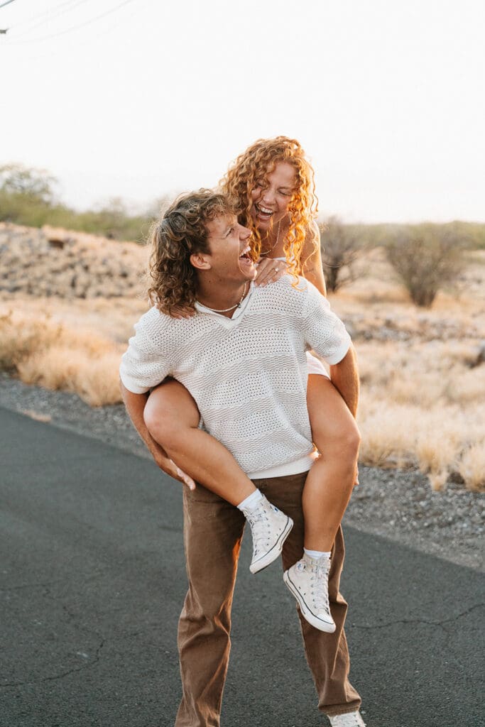 Couple Laughing On The Big Island At Sunset