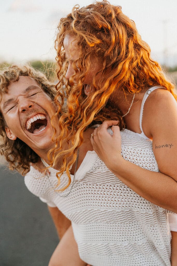 Couple Laughing On The Big Island At Sunset