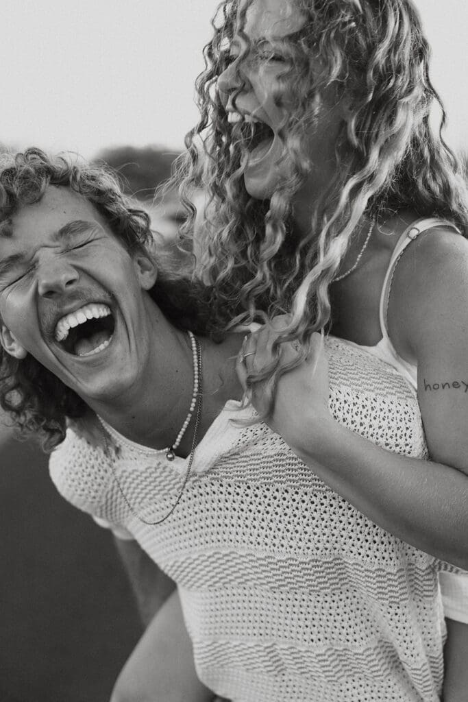 Couple Laughing On The Big Island At Sunset