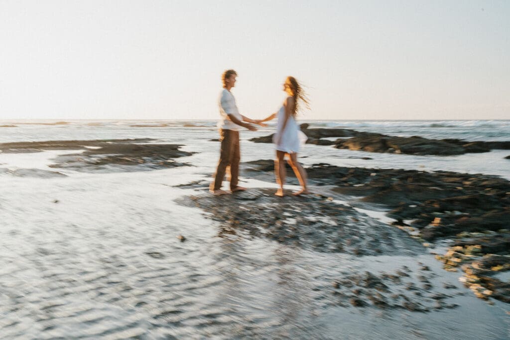 Couple Walking On The Beach On The Big Island At Sunset
