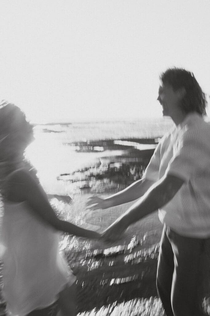 Couple Walking On The Beach On The Big Island At Sunset
