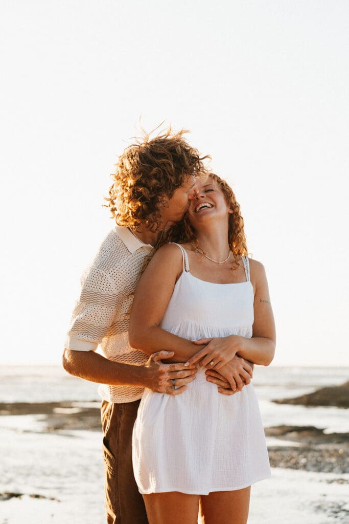 Couple Hugging On The Beach On The Big Island At Sunset